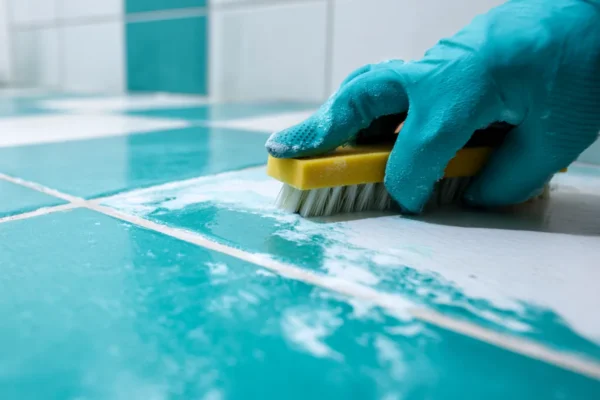 Scrubbing tile grout during a deep cleaning